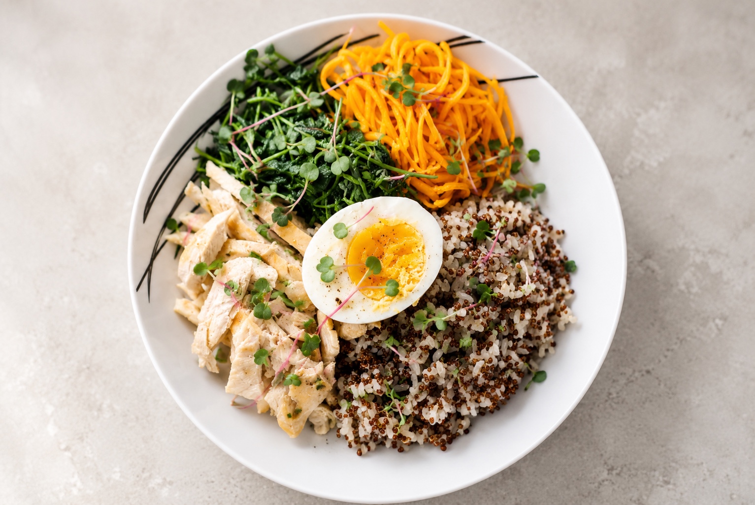 Healthy rice bowl with vegetables, egg, grains, and microgreens